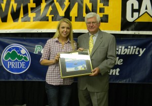 Jade Clemons accepts the PRIDE Volunteer of the Month Award from Congressman Hal Rogers