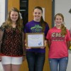 Clinton County Middle School students Jana Mullins, Chloe Martin and Olivia Maupin accepted the school’s PRIDE Environmental Education Project of the Month Award. PRIDE’s Mark Davis (left) presented the plaque, and Judge-Executive Lyle K. Huff congratulated the students on their achievement.