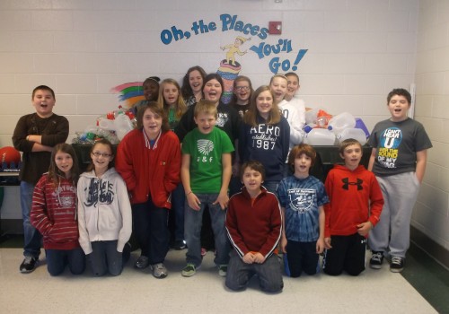 Fifth-grade math students from Tracie Hacker’s class posed with some of the plastic bottles collected for recycling by Hazel Green Elementary School. Photo by Bianca Hawkins.