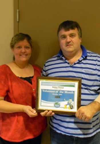 Bobby Thorpe, with his wife, Kim Thorpe, accepted the PRIDE Volunteer of the Month Award. Photo by Calvin Saum II.