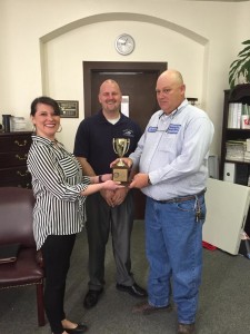PRIDE President/CEO Tammie Wilson presented the Roadside PRIDE trophy to Jackson County Judge-Executive Shane Gabbard and Solid Waste/Recycling Coordinator Jason Thomas.