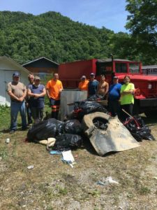Members of the Stinnett Volunteer Fire Department with trash they collected during the 2016 River Sweep.